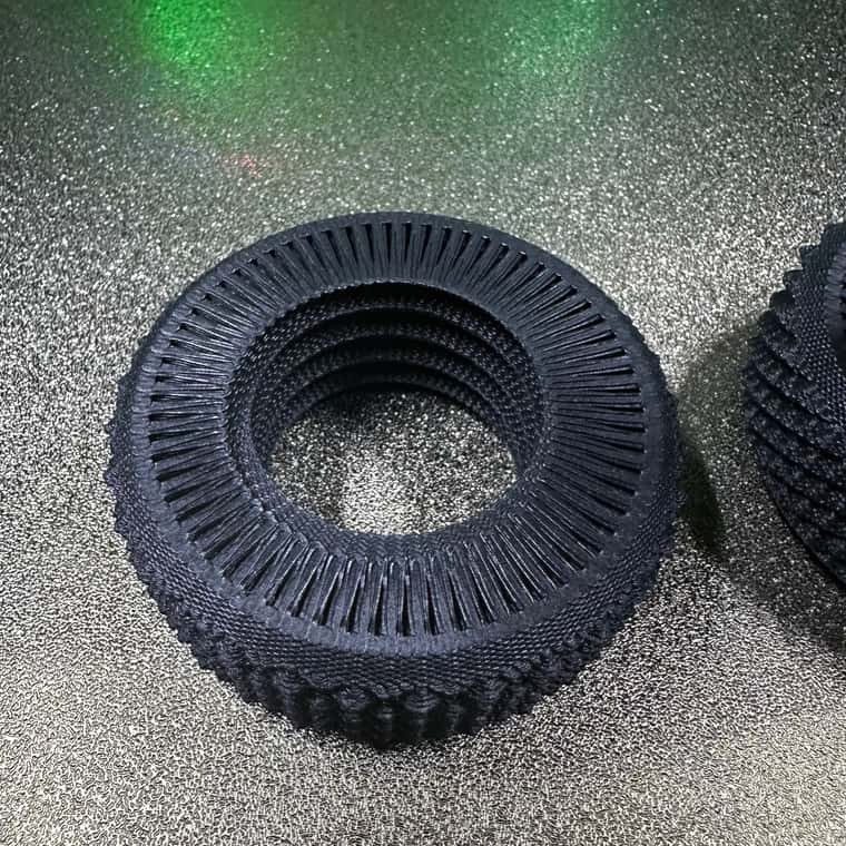 Close-up of a printed Serpentine part, the staggered tooth openings forming a dense staggered texture on the side wall